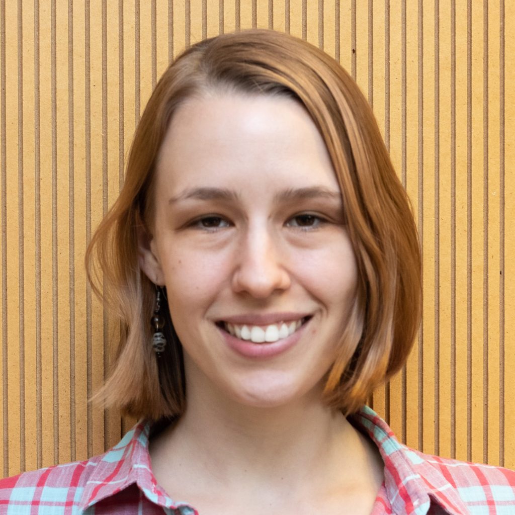 Headshot of Alicia smiling and looking straight at the camera.